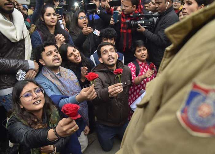 Woman offers rose to policeman 1