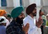 Sikhs offering prayers