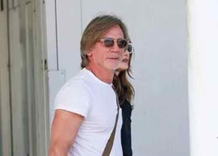 Daniel Craig sports long locks, looks unrecognisable as he touches down