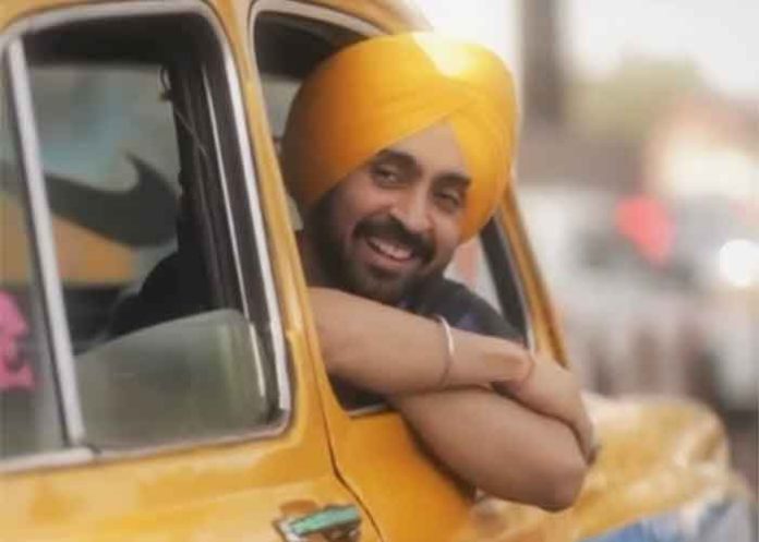 Diljit Dosanjh in yellow taxi