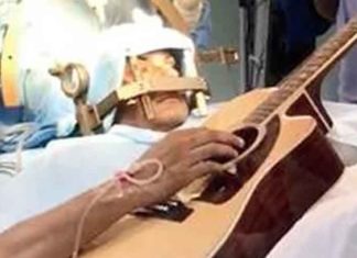 Doctors conduct brain surgery on guitar-playing