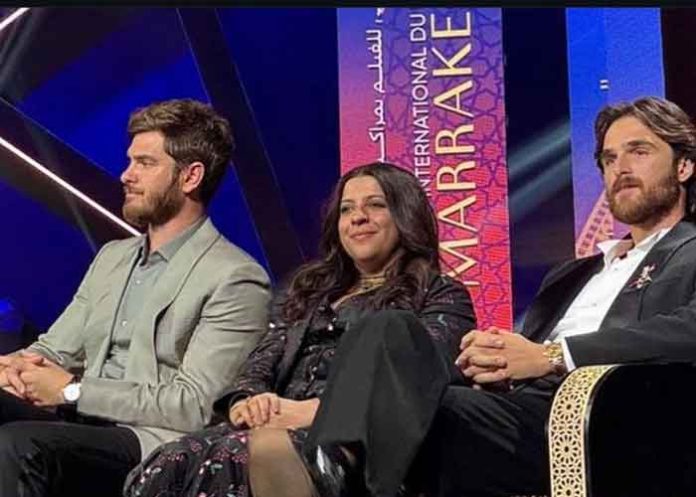 Zoya Akhtar sitting with Andrew Garfield, Jacob Elordi