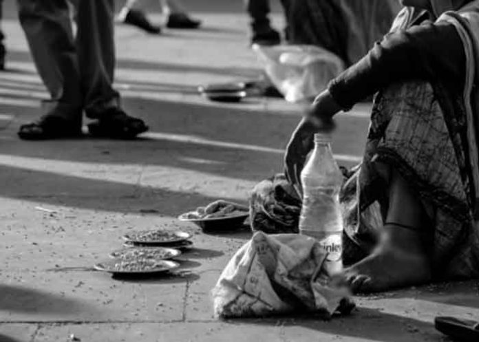 beggar on road