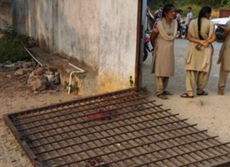 school gate falls on kid