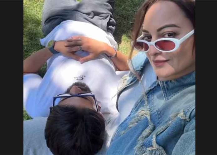 Zaheer Iqbal rests his head on Sonakshi lap