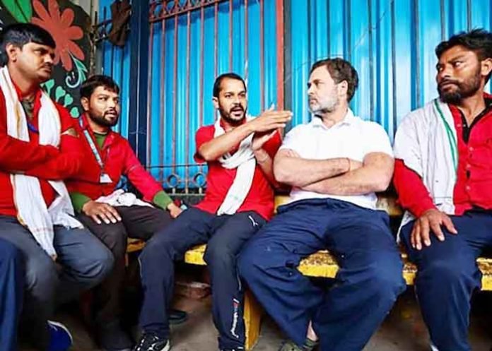 Rahul Gandhi interacts with coolies