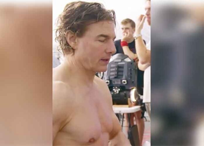 Tom Cruise removing his shirt