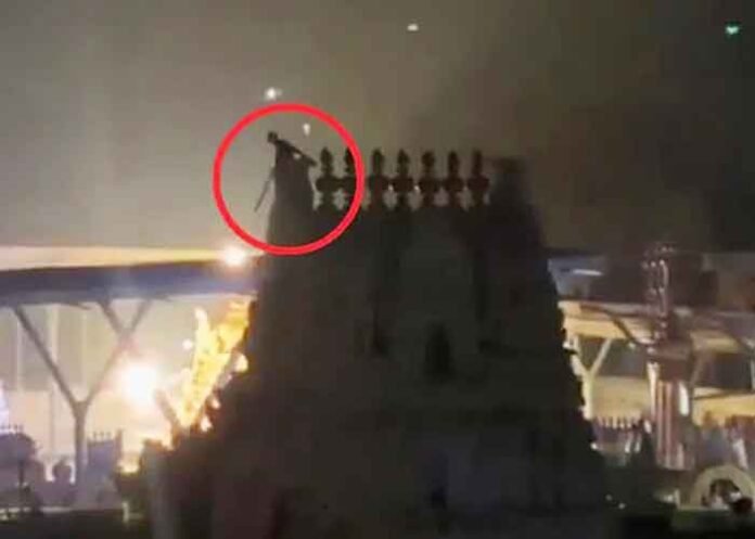Drunk man kalashams at Tirupati temple tower
