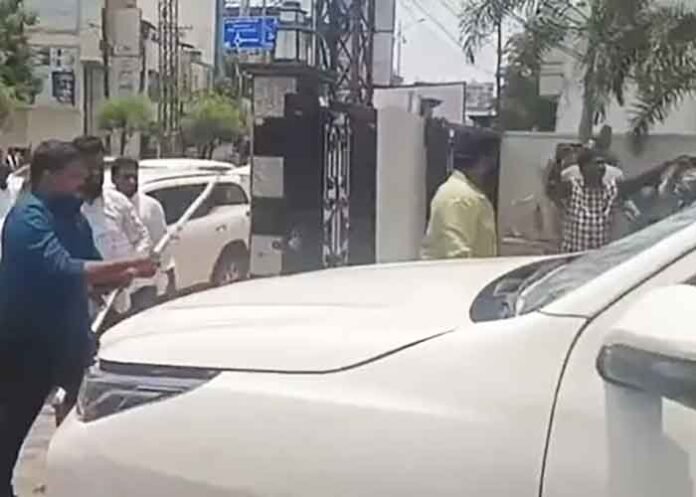 BJP men attack damage car in Karimnagar