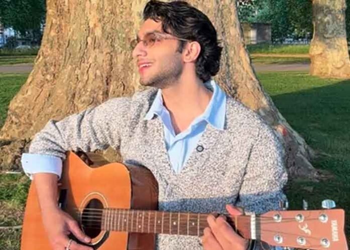Vedang Raina with guitar