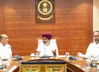 Harpal Cheema in a meeting