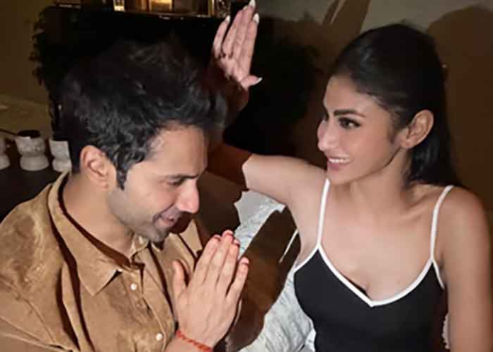 Varun Dhawan takes blessing from his on screen 'Maa' Mouni Roy