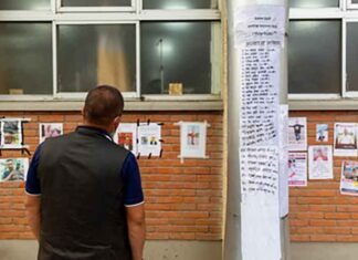Families put up posters outside Kathmandu hospital in hope of finding their loved ones Families put up posters outside Kathmandu hospital