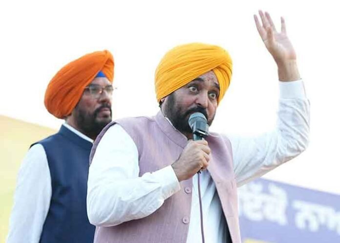 CM Mann on mic in public village