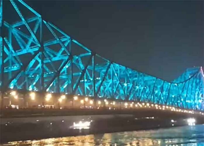 Iconic Howrah Bridge illuminated with dynamic architectural lighting