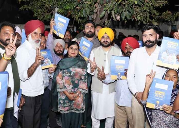 Tarunpreet Singh Sond distributes property cards to 227 households
